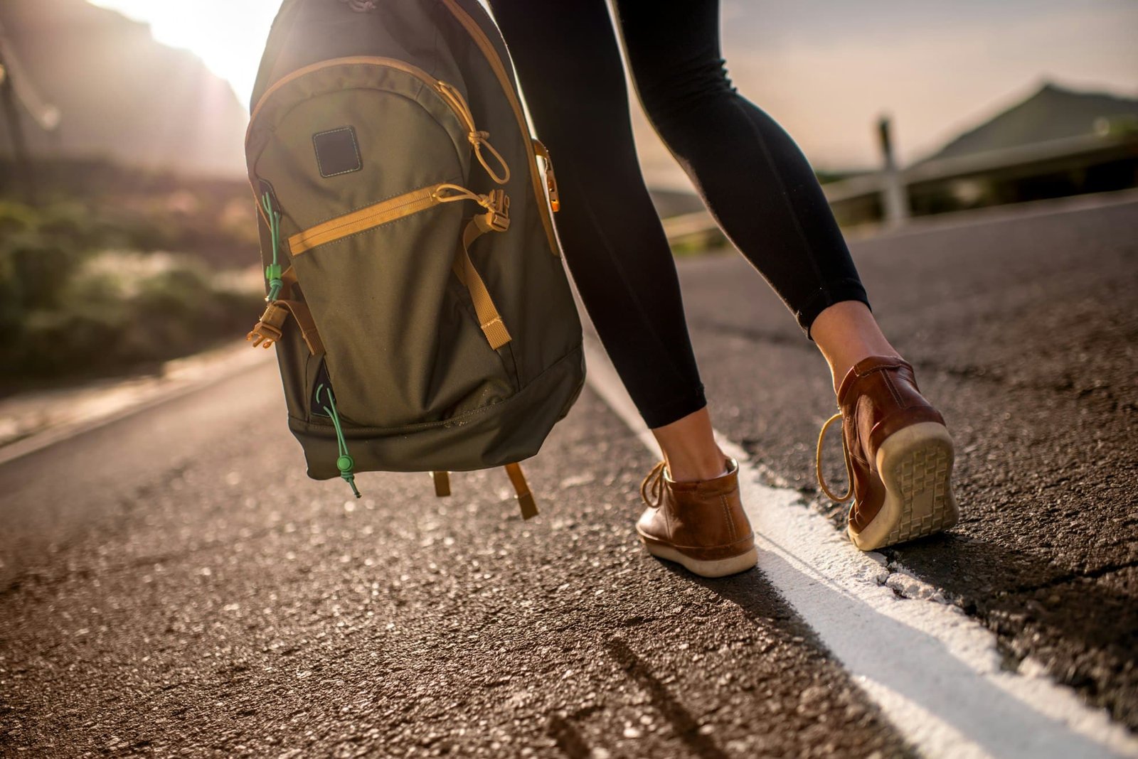 Traveler with backpack on the road