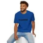 A man sits on a white block, smiling in his blue Failstate Softstyle T-shirt paired perfectly with light jeans.